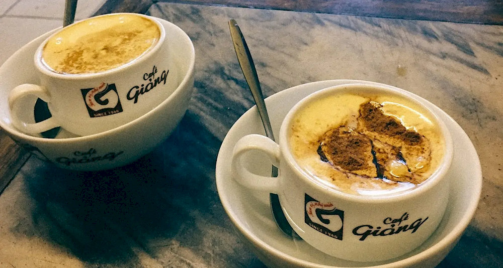 Cafe Giang is a historic coffee shop in Hanoi, renowned for inventing the city's famous egg coffee